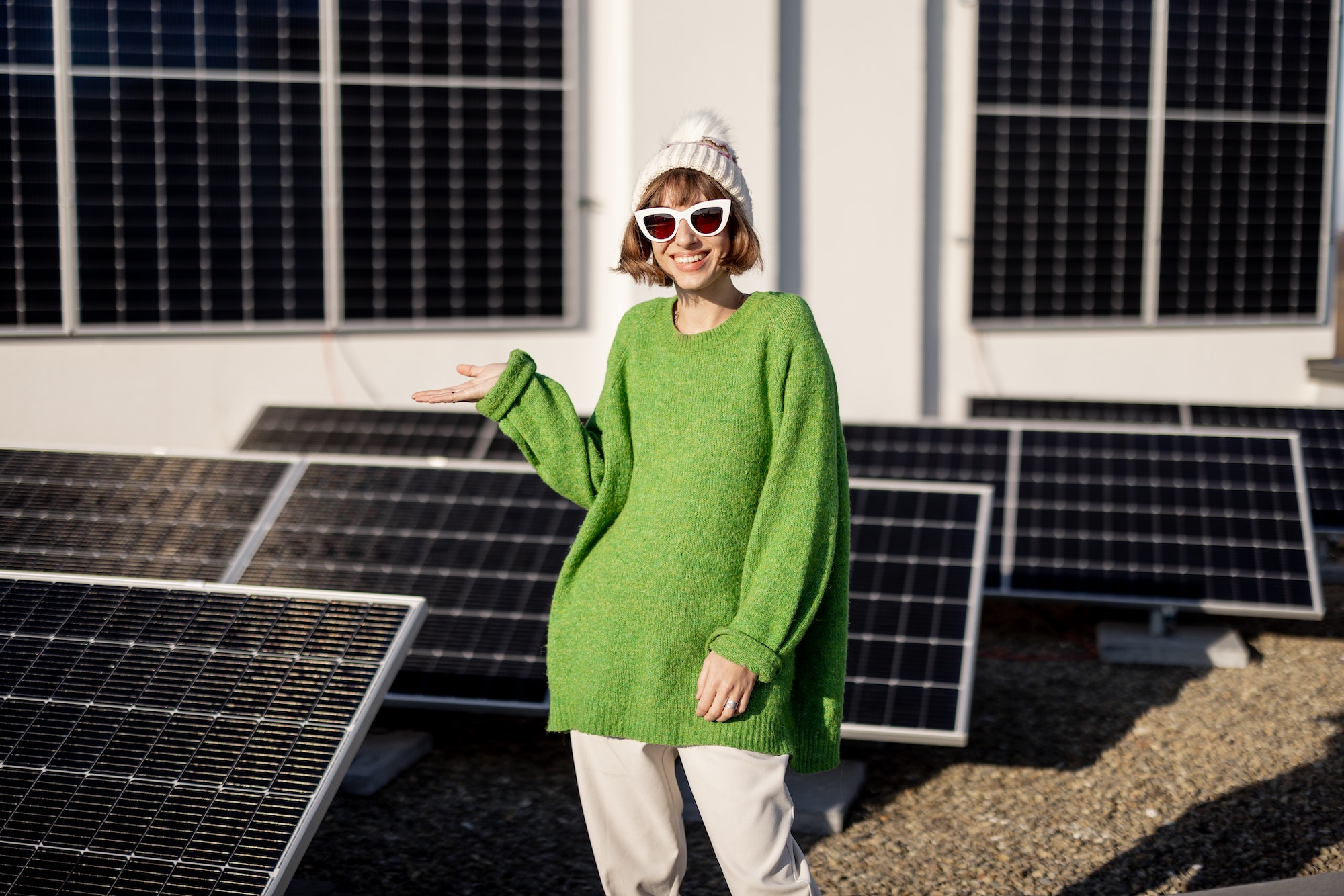 Happy house owner with a solar plant